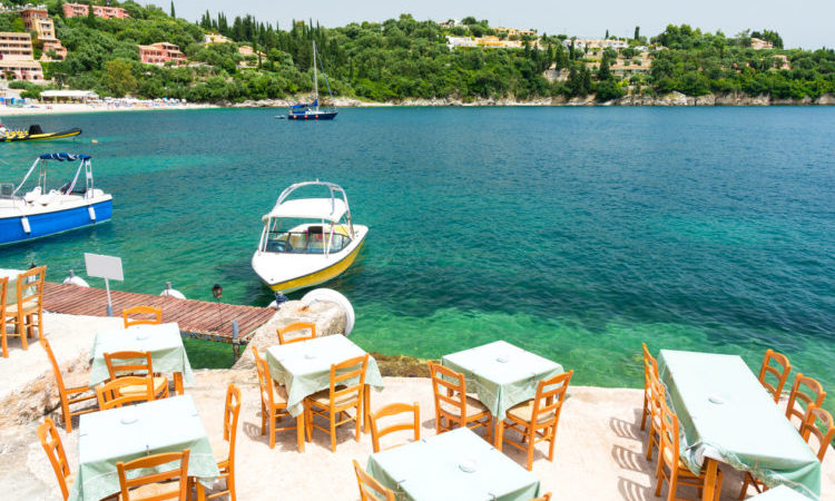 greek tavern over beautiful bay in Kalami in Corfu island, Greece