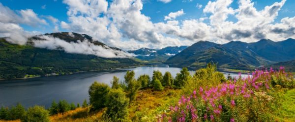 Early morning at Loch Duich in the Highlands of Scotland with low lying clouds and mountain views